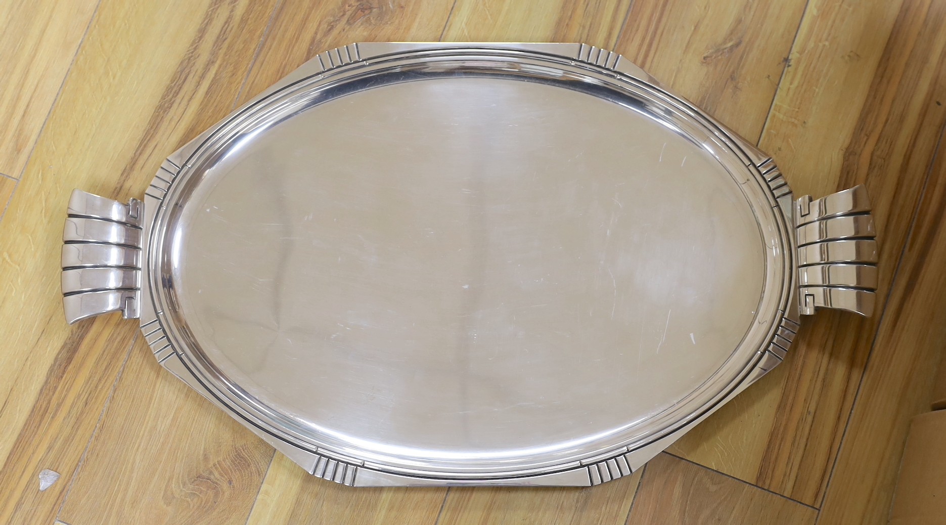 A large French silver plated two handled Art Deco tray. 74cm wide